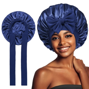 Navy blue satin hair bonnet with long ties and a large bow for luxury hair protection