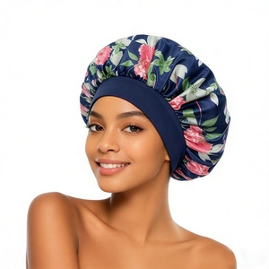 Floral satin sleep bonnet for women featuring pink flower patterns on a navy blue fabric
