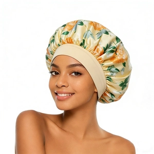Detailed close-up of wide elastic band and floral satin fabric on the sleep cap