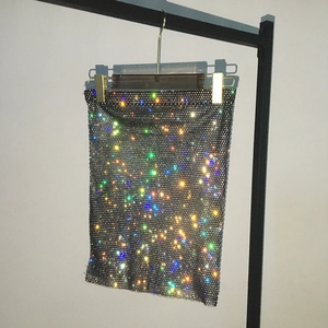 Close-up of rainbow rhinestones on black mesh fabric of this sexy party mini skirt