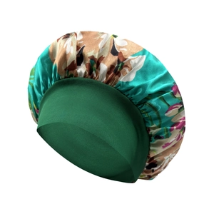 Detail of floral printed satin sleep cap with wide elastic band for hair protection