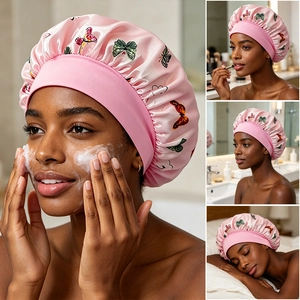 Pink satin hair bonnet with butterfly print and wide elastic band for sleep hair care