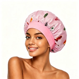 Pink satin sleep cap with butterfly print and wide elastic band for hair care protection