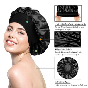 Detail view of black satin sleep cap featuring a wide cotton elastic band for long hair