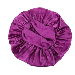 Detail of deep purple satin sleep bonnet with elastic wide band for hair protection
