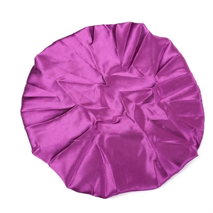 Close-up of a purple satin baby sleep cap with elastic wide band and smooth texture