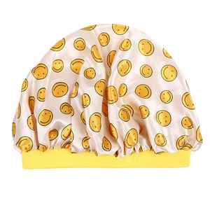 Champagne satin sleep bonnet for kids with yellow smiley face patterns and elastic band