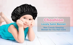 Detail of toddler wearing a black satin bonnet with a wide elastic headband for hair care