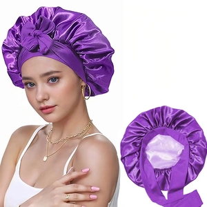 Detail view of purple satin bonnet with elastic wide band and soft inner lining
