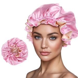 Pink double-layered satin silk sleep cap with adjustable ruffled edge for comfortable hair care