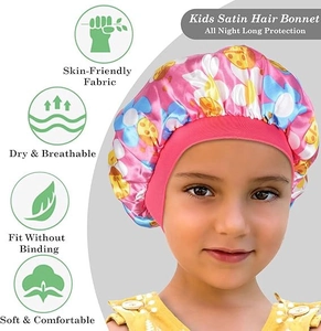 Detail of pink satin sleep cap for toddlers with floral print and soft elastic wide band
