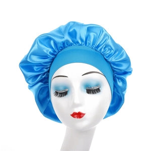 Detail of blue satin bonnet featuring a wide elastic band for hair protection