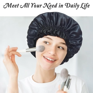 Detail of black satin hair bonnet with elastic lace edge worn during makeup routine