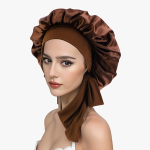 Brown satin sleep bonnet with wide elastic band and side ribbons for hair care protection