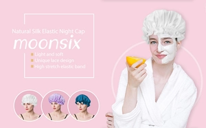 Detail of silk satin sleep cap with lace trim and high elastic band for hair care