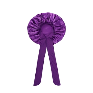 Deep purple satin hair bonnet with wide stretch bands and a large bow for hair protection