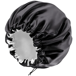 Double-layered satin sleep cap in black and white with an adjustable elastic drawstring