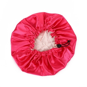 Detail of rose pink double-layered satin bonnet with adjustable buckle for hair care