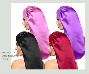 Detail view of satin hair bonnets in pink purple black and wine red colors