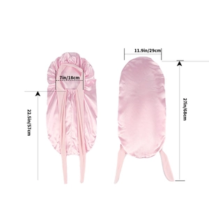 Pink long satin sleep cap for hair protection featuring adjustable ribbons and soft fabric
