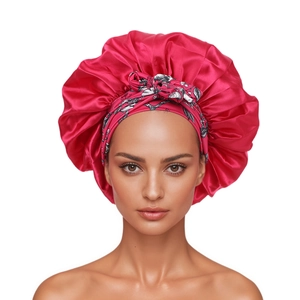 Magenta satin sleep bonnet with black and white floral bow headband for hair care