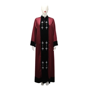 Detailed close-up of velvet panels and crystal floral embroidery on a satin abaya gown