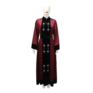 Detail of burgundy satin and black velvet拼接 with rhinestone snowflake embroidery