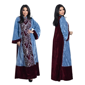 Detail of velvet abaya featuring blue and burgundy contrast panels and silver sequins