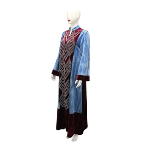 Detail of velvet kaftan robe featuring rhinestone geometric patterns and color block design