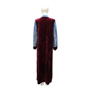 Rear view of velvet long robe featuring wine red pleated fabric and blue sleeves