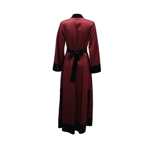 Detail of burgundy satin robe with black velvet trim and back waist tie closure