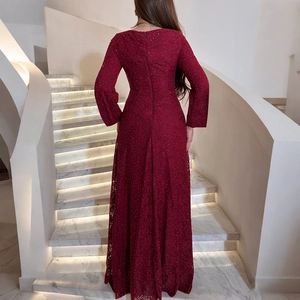 Detail of burgundy lace dress back showing slim fit cut and sparkling floral texture