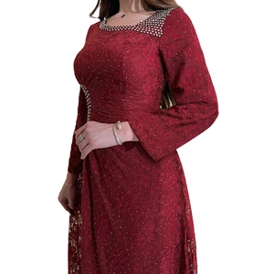 Detail of burgundy lace evening dress showing rhinestone collar and delicate floral textures