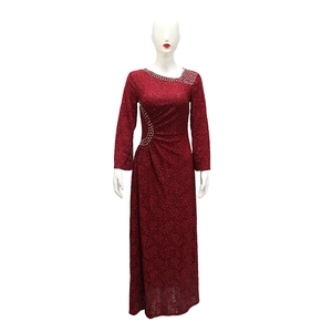 Close-up of wine red lace evening dress with rhinestones and elegant pleated waist detail