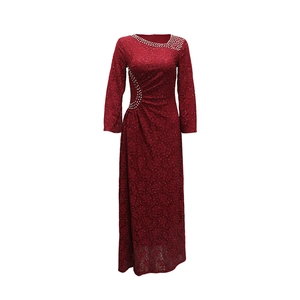 Detailed view of burgundy lace maxi dress featuring white rhinestone patterns and waist pleats