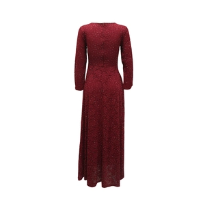 Detail of burgundy lace dress with delicate floral patterns and shimmering sequins
