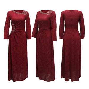 Macro detail of wine red lace maxi dress with sparkly rhinestones on waist and neckline