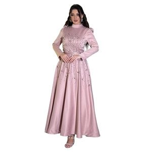 Detail of beaded floral embroidery and 3D applique on dusky pink satin gown waist
