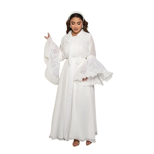 Close-up of white abaya dress featuring elegant lace patchwork and pleated flared sleeves