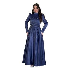 Detailed view of intricate beadwork and floral embroidery on a navy blue satin gown waist