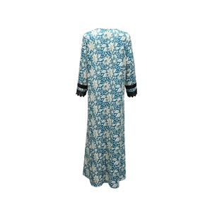 Close-up of bohemian floral print maxi dress with V-neck and black lace sleeve detail