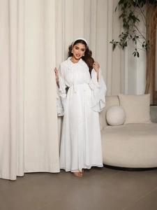 Elegant white Abaya dress with ruffled lace sleeves and a matching tie-waist belt