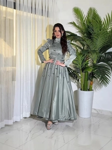 Elegant sage green long sleeve evening gown with intricate 3D leaf appliques and beads