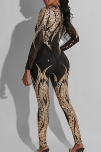 Detail of gold sequin embroidery on back of a black sheer long sleeve bodysuit