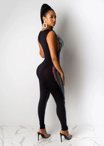 Detailed view of women's black jumpsuit featuring colorful side sequins and slim fit design