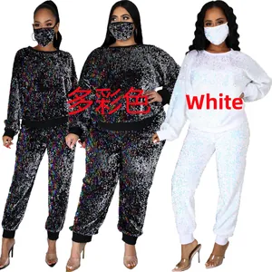 Close-up of sequin loungewear set with matching mask in multicolor and white