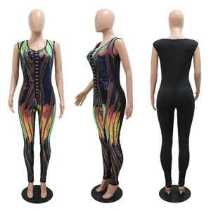 Front and back views of a sequined jumpsuit with a lace-up neckline and geometric pattern