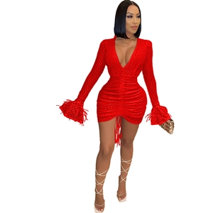 Elegant red deep V-neck mini dress featuring ruched drawstring and feather cuffs