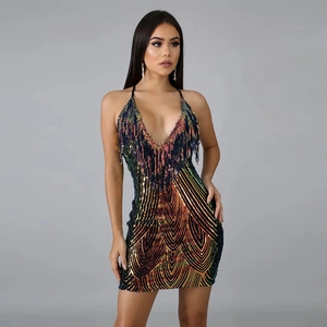 Close-up of iridescent sequins and delicate fringe on a sparkling deep V-neck party dress