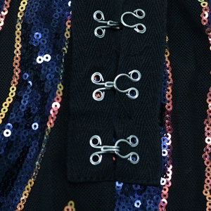 Detailed macro view of secure hook and eye closures on a sequined high waist jumpsuit